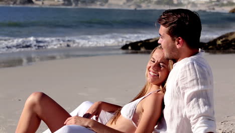 attractive couple relaxing on the beach