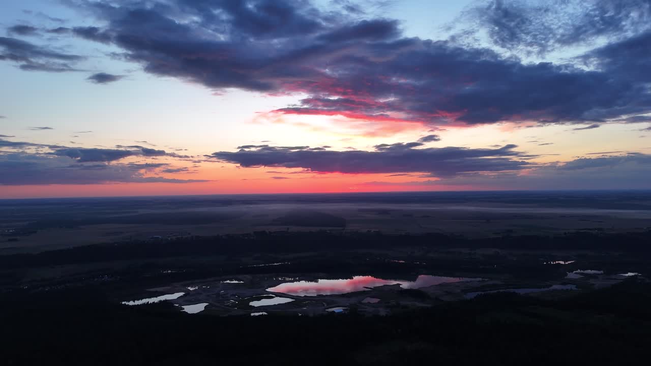 Stunning Aerial View of Sunset over Lakes and Fields