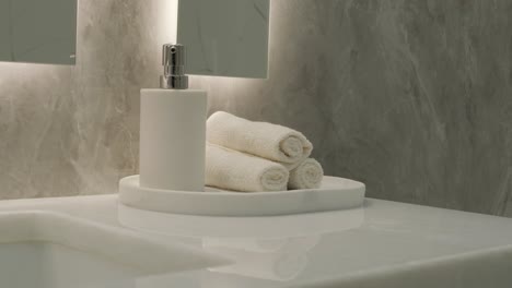 elegant bathroom vanity detail with marble backdrop