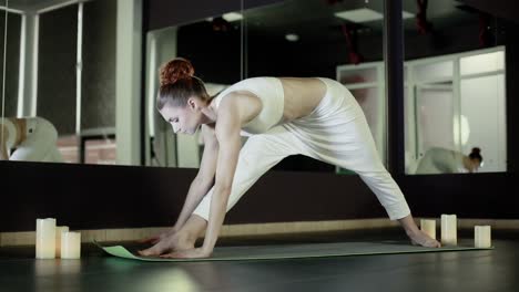 the girl is in the yoga hall