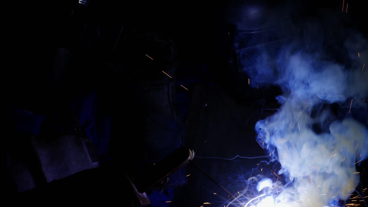 Welders welding a metal
