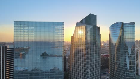 sunset over modern city skyscrapers
