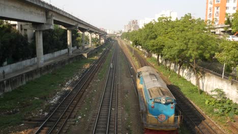 train tracks and cityscape in bangladesh