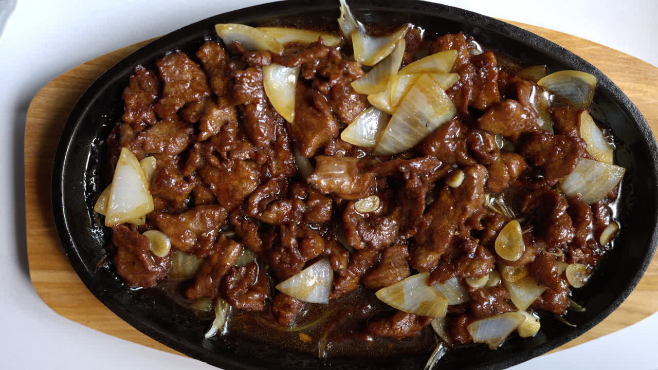 Beef meat slices with onion and sauce in a japanese restaurant