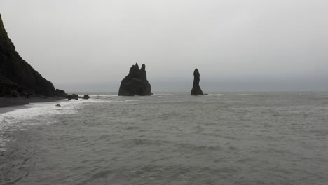 drone shot of reynisdrangar rocks in a stormy sea