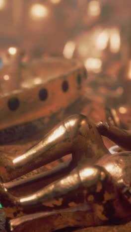 close-up of a golden statue with a crown