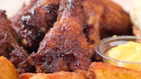 crispy bbq chicken wings with fries and mustard