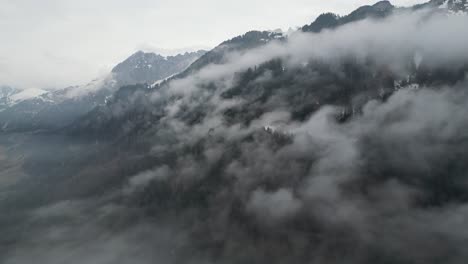 Klöntalersee-Glarus-Switzerland-mountain-side-hidden-by-clouds