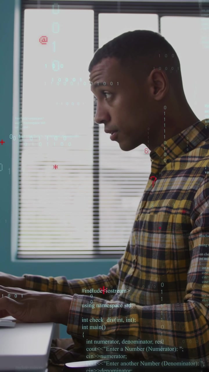 Vertical video: Developer typing and noting with pen on monitor cue, tech code flowing over hands
