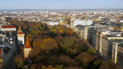 Aerial-view-of-Old-Town,-Florian-Gate-and-Barbican-in-Krakow-in-autumn-scenery