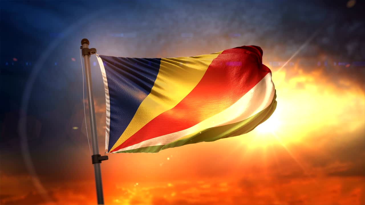 la bandera de las seychelles retroiluminada en un hermoso ciclo de amanecer en cámara lenta 4k
