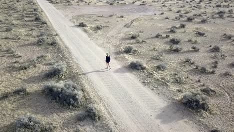 a girl walk, runs and dances along a small path all alone