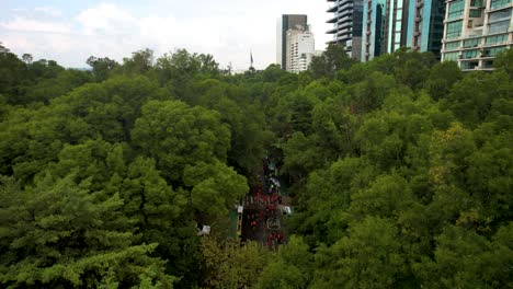 aerial drone shot of the runners of the mexico city marathon passing through the national auditorium