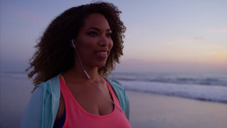 plus size ethnic female doing workout to music