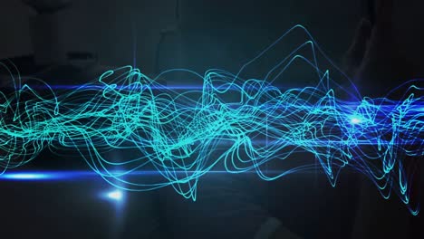 animación de un punto de luz azul y ondas digitales contra un fondo negro