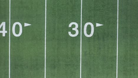 aerial view of american football field's yard line numbers