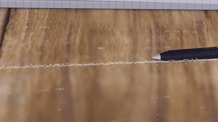 Data visualization being drawn over wooden desk, showing dotted line graph with pen tracing