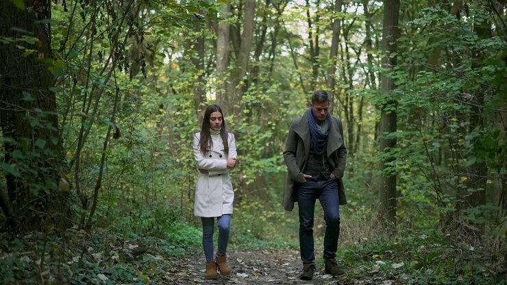 Couple walking in the forest