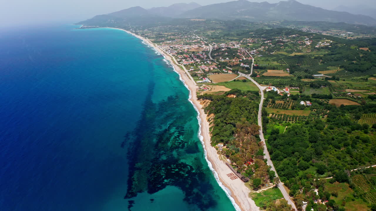 Stunning Aerial View of a Coastal Beach and Town