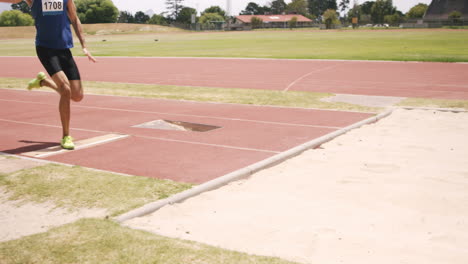 sportsman doing long jump