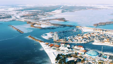 Harderwijk,-Netherlands-from-Above-on-Sunny-Winter-Day,-Aerial-Drone-View-on-Snow-Covered-City