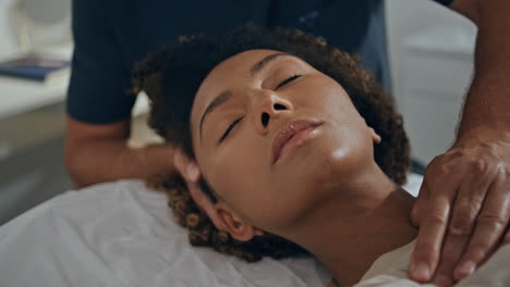 patient doing recovery treatment on chiropractor session. closeup woman lying