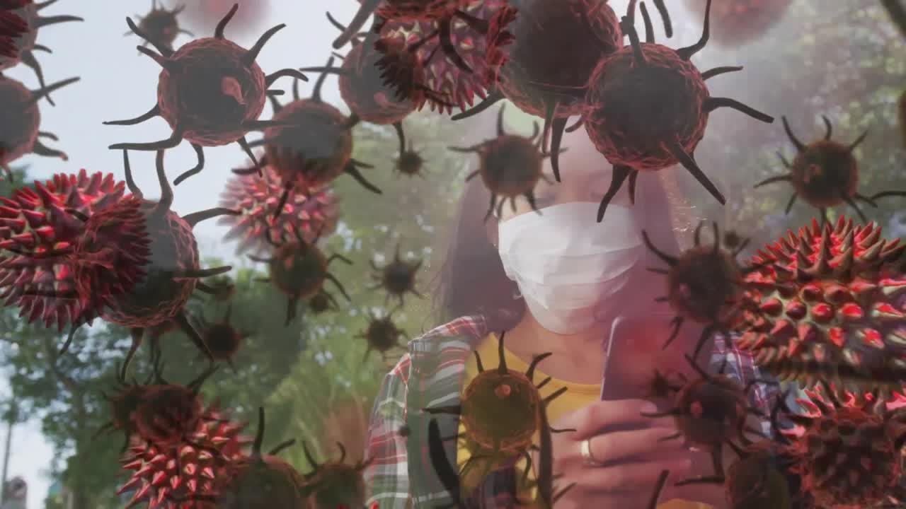 Animation of macro coronavirus Covid-19 cells spreading over a woman wearing a face mask in nature