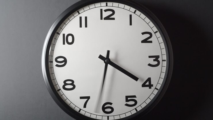 Clock Face Full Circle 12 hours on dark grey background in time lapse