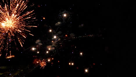 slow motion of fireworks lighting up the night sky with vibrant colors