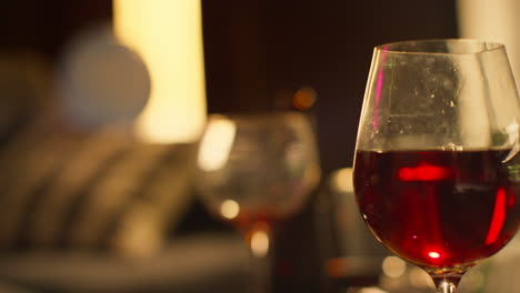 Close-Up-Of-Wine-Glasses-And-Beer-Bottles-On-Table-After-House-Party-1