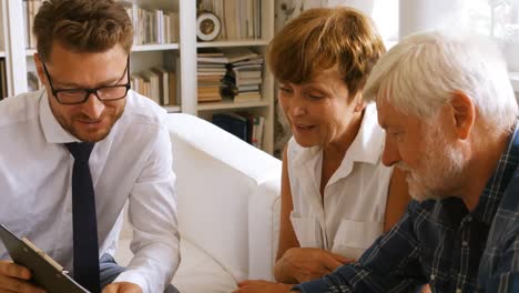 senior couple planning their investments with financial advisor