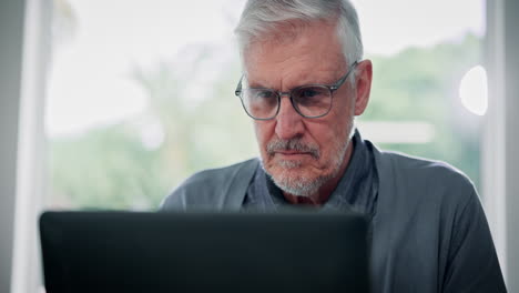 senior man working on a laptop