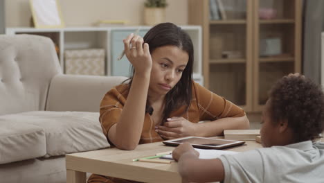 mother helping child with homework