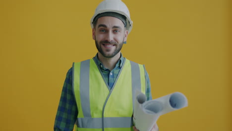 construction worker with blueprints