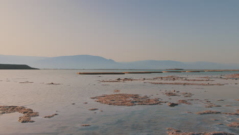 dead sea timelapse at sunrise with salt mushrooms and the stunning jordan mountains in the background