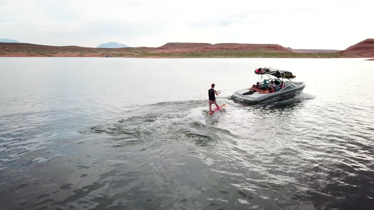 Drone shot of wake surfing in Lake Powell Utah