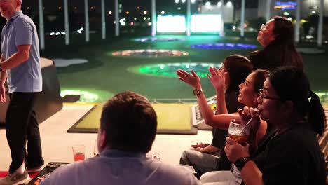 friends enjoying a golf-themed party together