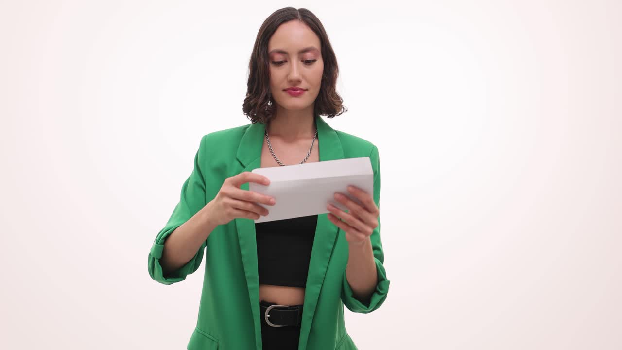 Woman opening an envelope or letter