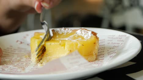 over head view of women eating lemon tart ,