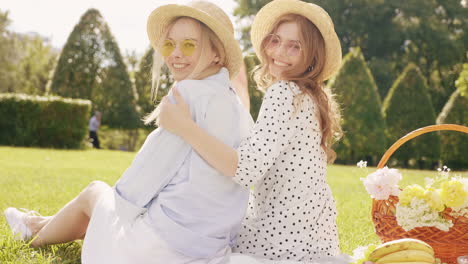 two friends enjoying a picnic in a park