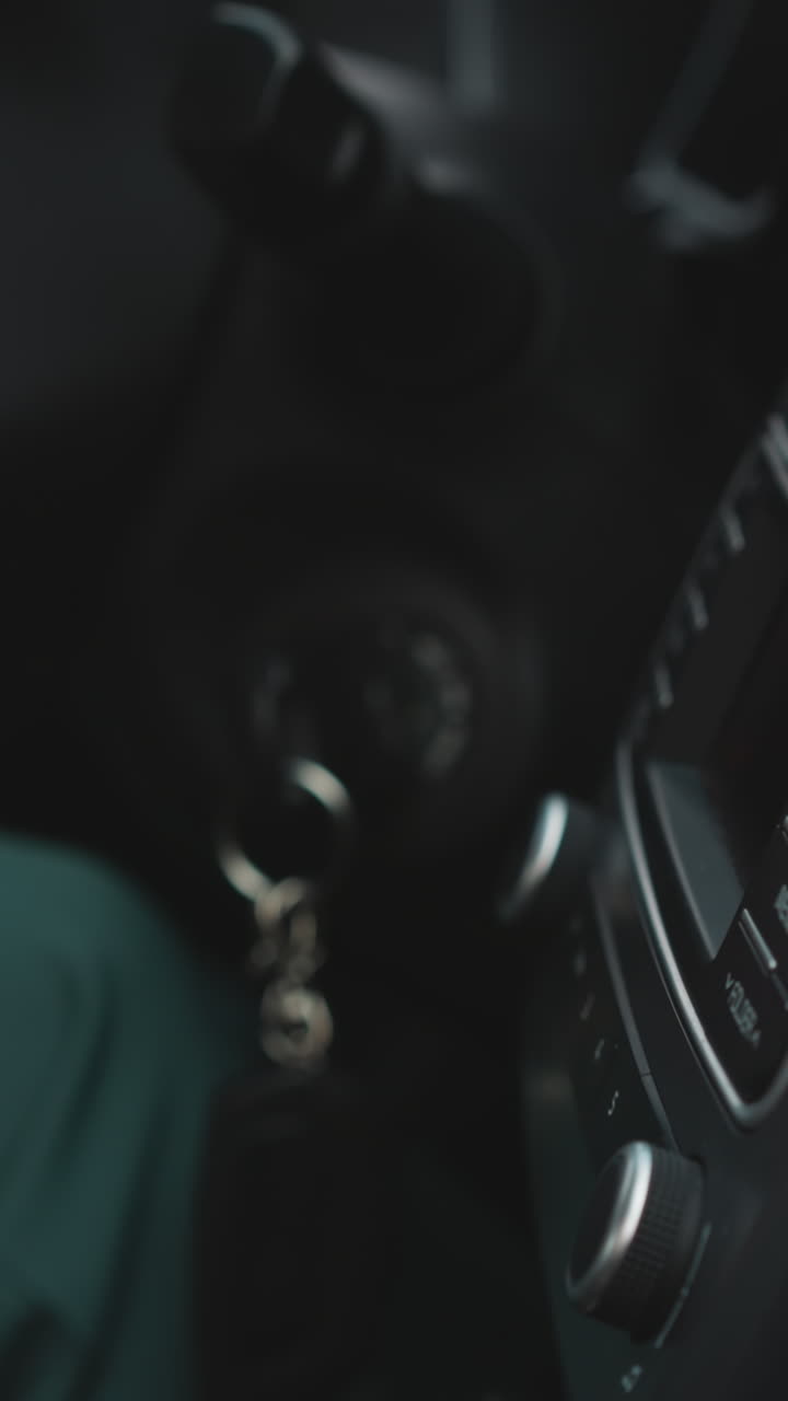 Woman turns on air conditioning system on panel in car with hand. Female drives adjusting temperature in vehicle salon for comfortable trip closeup