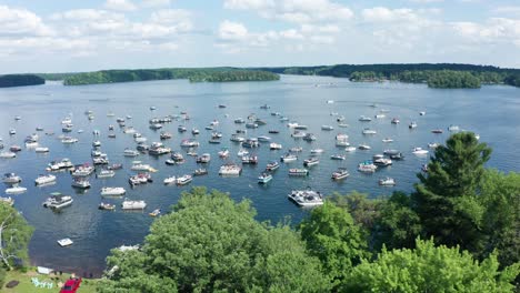 lake crowded with spring break party boats during college spring summer break