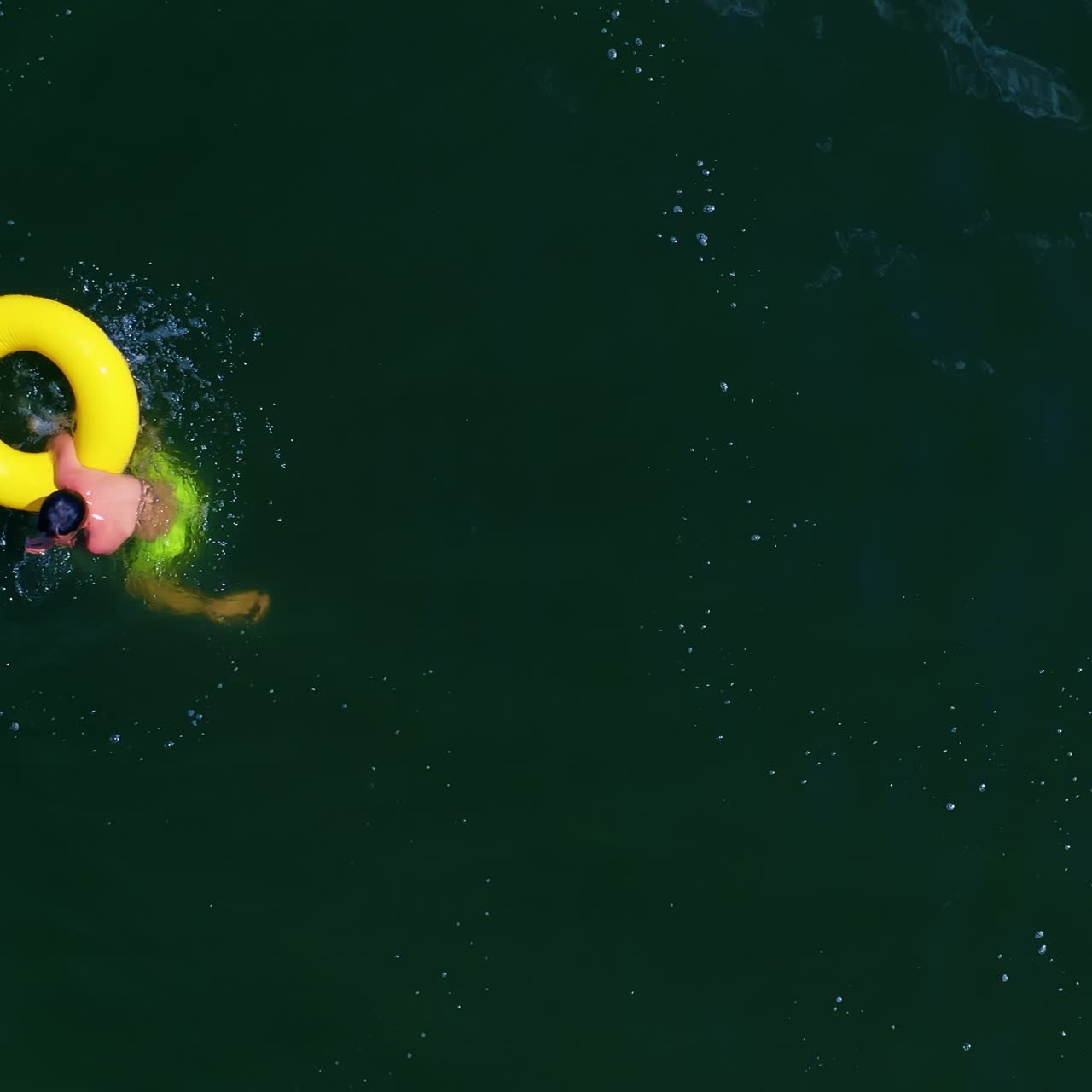 Boy with inflatable swim ring