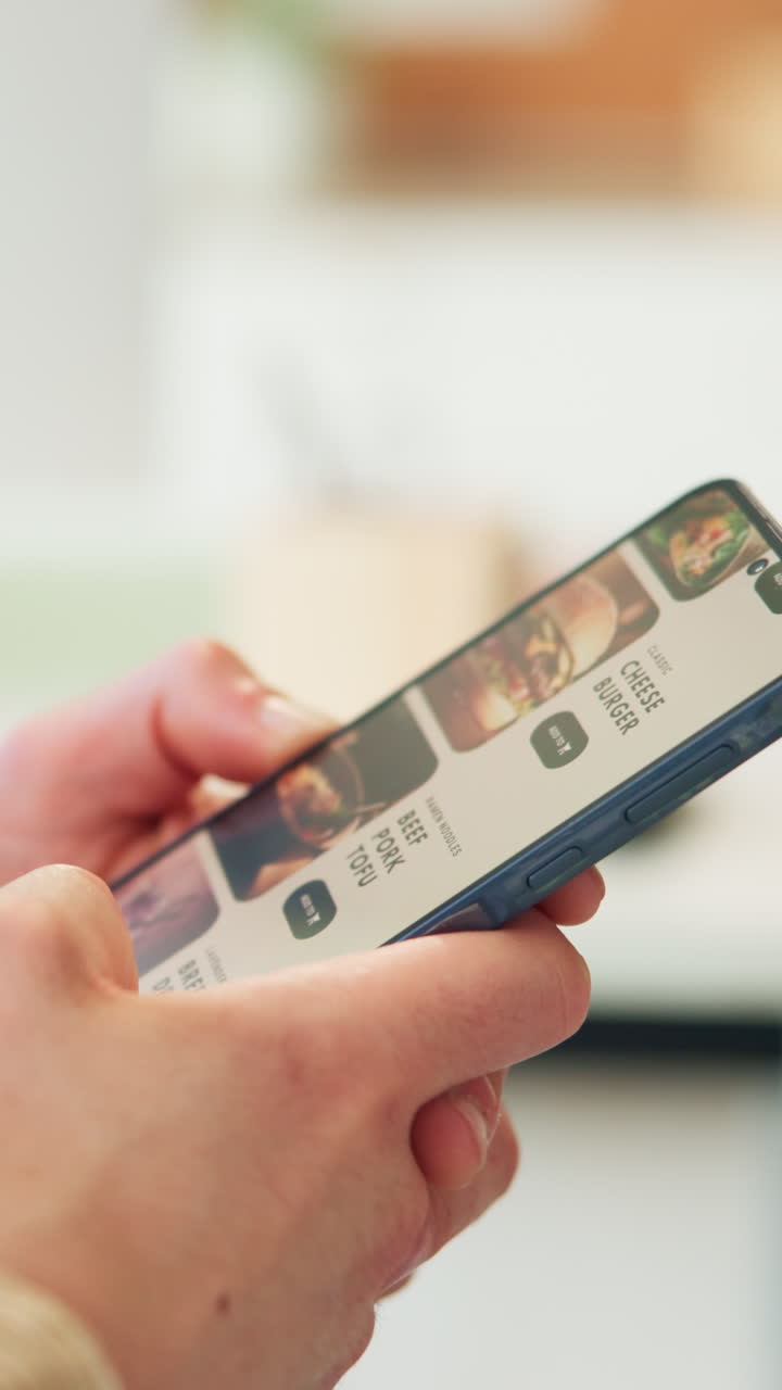 Close-up of Hands Scrolling Through Food Delivery App on Smartphone
