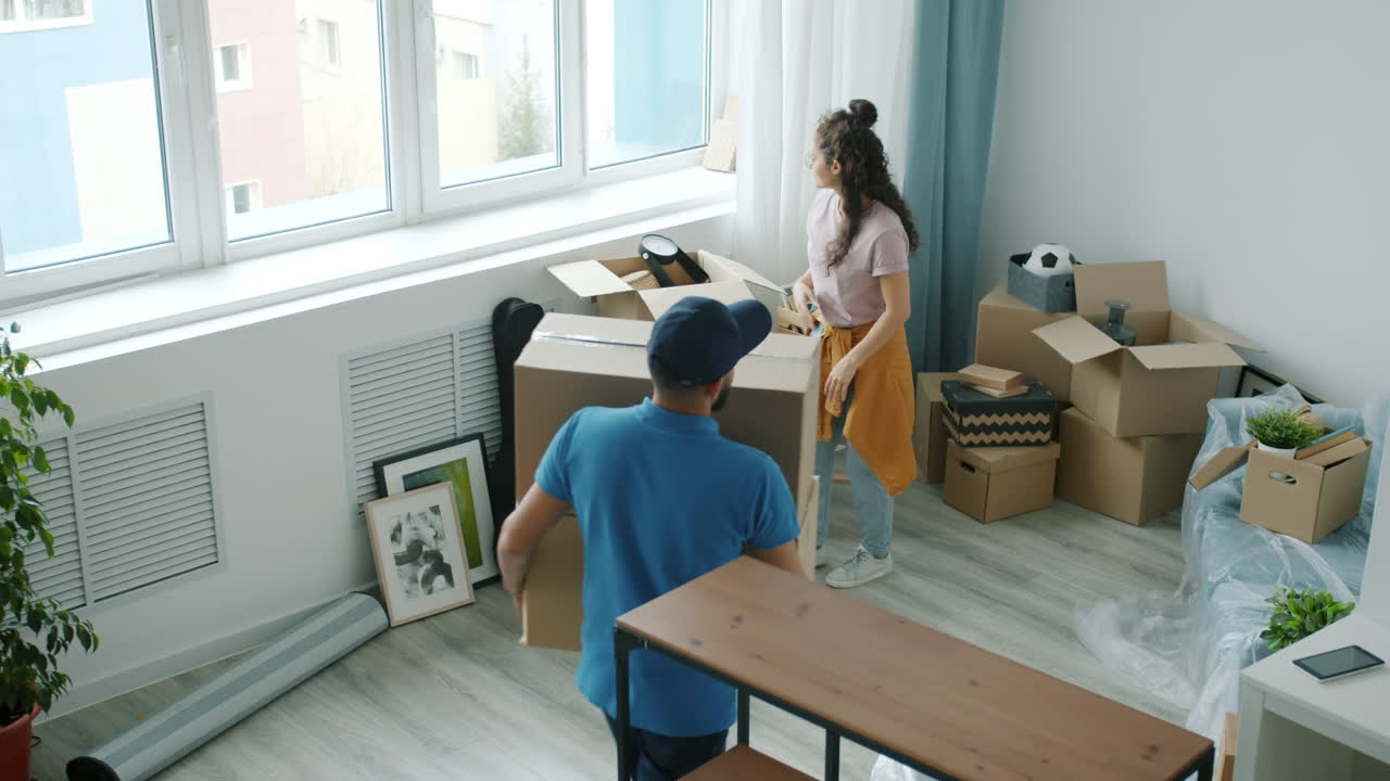 Couple Moving Into New Apartment