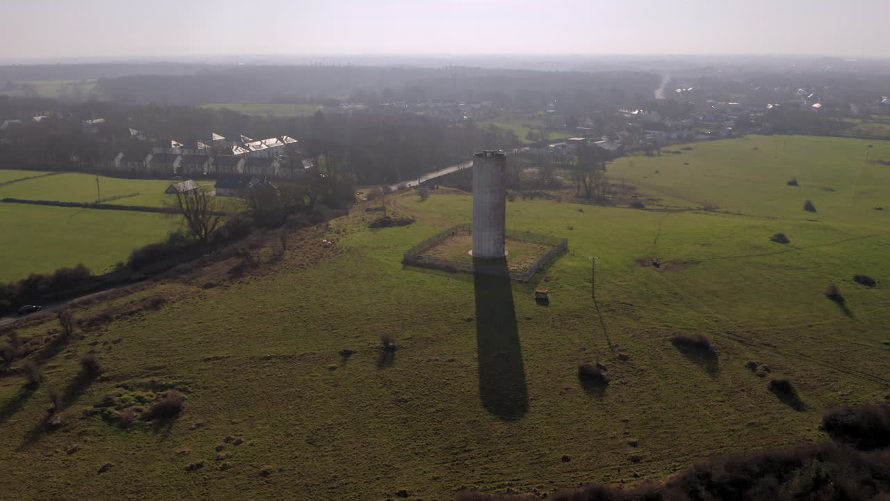 Aerial drone footage of Clarinbridge water tower backlit by the soft morning sunshine. Galway