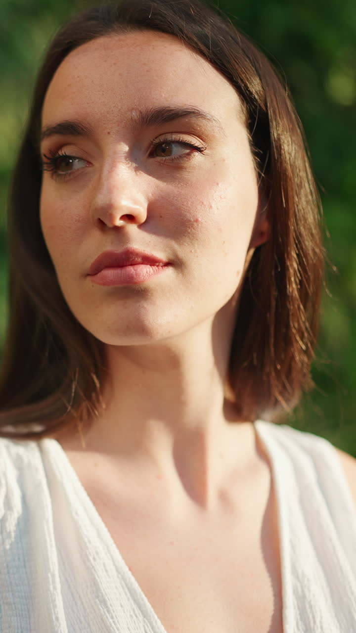 Portrait of a brunette woman outdoors