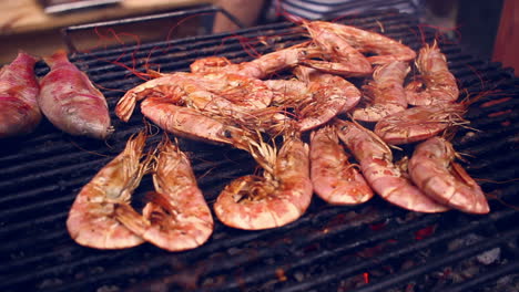 grilling shrimps on barbecue. grilled seafood on bbq. closeup of grilled shrimps