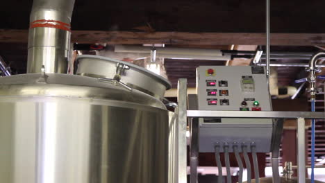 freshly brewed hot beer foams in the brewing tank