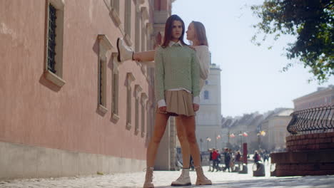 two young women walking in a european city